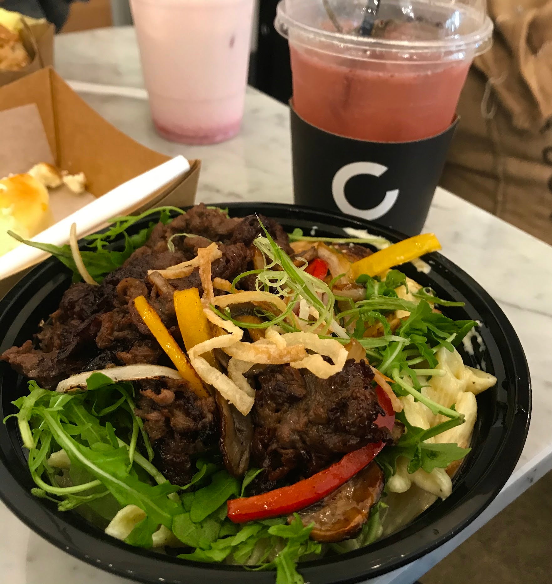 Korean fusion brunch at C Market Coffee, featuring a huge Croissandwich filled with a satisfying amount of ingredients and Bulgogi Cream Pasta, where the sweetness and saltiness of the meat are perfectly balanced with the creamy pasta.