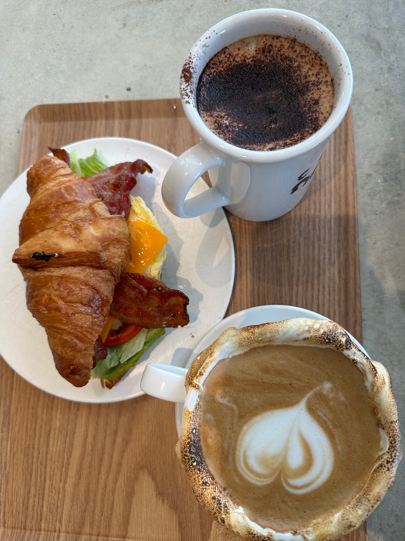 A gastronomic journey at C Market Coffee with distinctive offerings like the Cotton Candy Latte, A+ Croissant, and Tiramisu Latte. The lattes had a remarkably velvety texture, with a pronounced coffee flavor that created a harmonious blend, leaving a lasting impression.