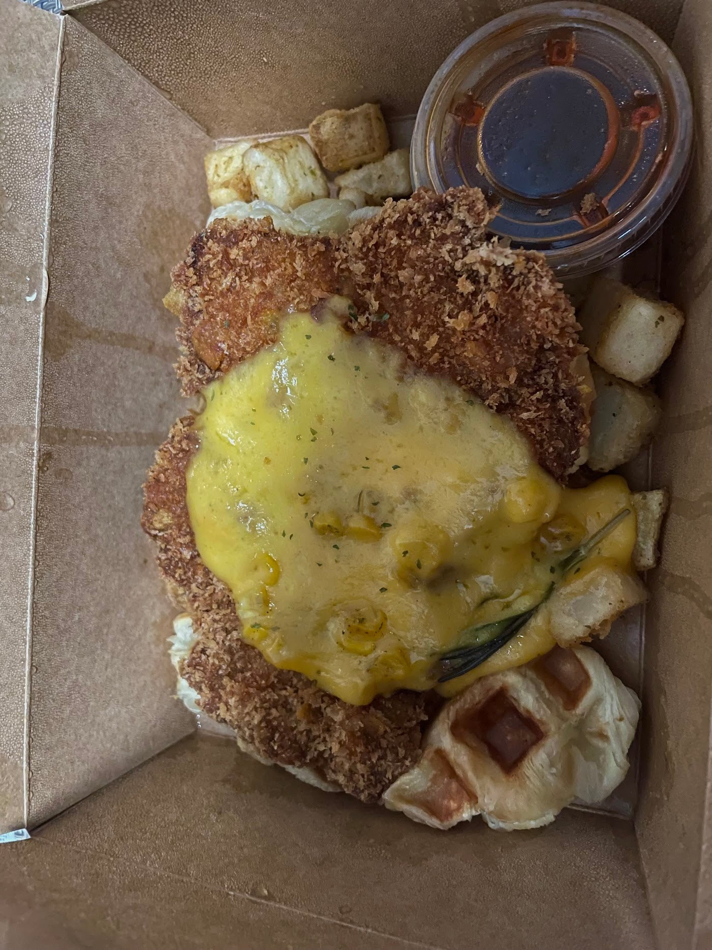 Chicken and Waffles along with Chocolate Cake ordered through SkiptheDishes, packaged nicely and enjoyed for both their great appearance and taste at C Market Coffee.