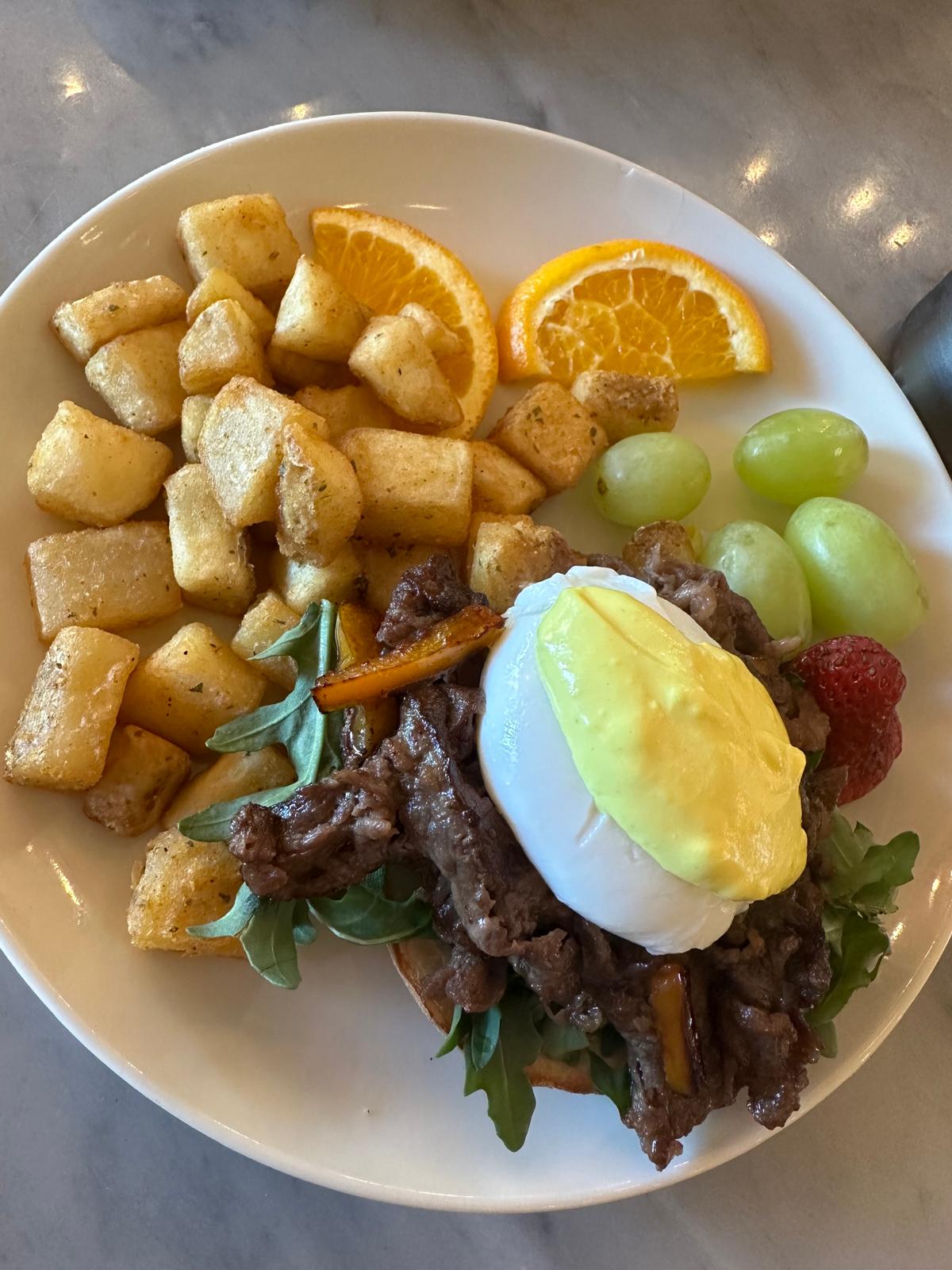 A customer enjoying the option to choose between a single or full-size meal at C Market Coffee, appreciating the flexibility for smaller appetites and expressing excitement to return and try more menu items.