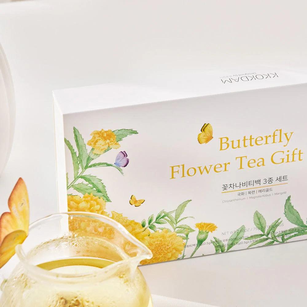 A close-up view of a box and a glass jar placed side by side on a flat surface. The box is elegantly designed, featuring a sleek exterior with intricate detailing, while the glass jar is filled with flower-shaped tea sticks, their vibrant colors visible through the transparent glass. The jar is topped with a simple lid, and the packaging complements the premium quality of the product. The background is neutral to ensure the focus remains on the box and jar combination.