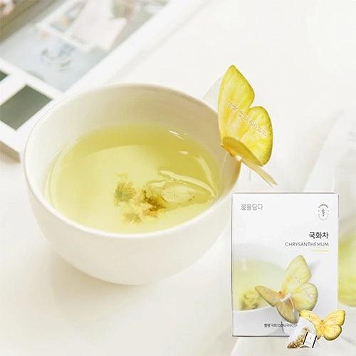 The Chrysanthemum Butterfly Teabag set includes three tea bags, each held by a charming butterfly-shaped holder that rests delicately on the edge of a glass. This handcrafted tea, made in Korea, uses natural ingredients to create a gentle, floral flavor. Ideal for newcomers to tea, Chrysanthemum tea offers a soft, soothing taste without caffeine. The whimsical butterfly design enhances the tea experience, and the product contains no food additives, ensuring a pure and natural taste in every sip.