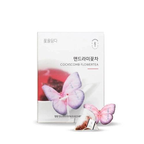 The Cockscomb Butterfly Teabag features a butterfly-shaped holder that delicately balances on the edge of a glass, containing Cockscomb tea made with natural ingredients. Its soft aroma and gentle flavor embody love and passion, with red blooms symbolizing strength. This caffeine-free tea offers a calming experience and is perfect for those seeking a pure, natural flavor without additives. Handcrafted in Korea.