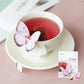 The Cockscomb Butterfly Teabag by KKOKDAM is a handcrafted tea with a whimsical butterfly-shaped holder that rests on the edge of a cup. It contains Cockscomb tea, known for its soft flavor and floral aroma, symbolizing love and passion. This caffeine-free, natural tea offers a gentle taste and is perfect for a relaxing, additive-free experience. Sourced from Korea.