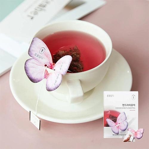 The Cockscomb Butterfly Teabag by KKOKDAM is a handcrafted tea with a whimsical butterfly-shaped holder that rests on the edge of a cup. It contains Cockscomb tea, known for its soft flavor and floral aroma, symbolizing love and passion. This caffeine-free, natural tea offers a gentle taste and is perfect for a relaxing, additive-free experience. Sourced from Korea.