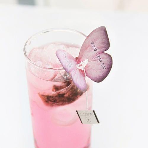 The Cockscomb Butterfly Teabag by KKOKDAM is a handcrafted tea with a whimsical butterfly-shaped holder that rests on the edge of a cup. It contains Cockscomb tea, known for its soft flavor and floral aroma, symbolizing love and passion. This caffeine-free, natural tea offers a gentle taste and is perfect for a relaxing, additive-free experience. Sourced from Korea.