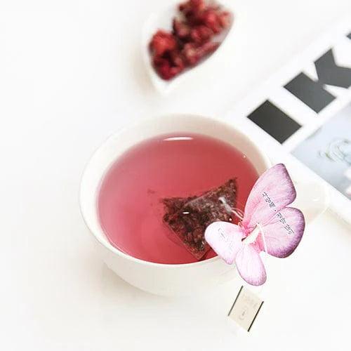 Cockscomb Butterfly Teabag by KKOKDAM features a butterfly-shaped holder that rests on the cup's edge, adding a touch of whimsy. The tea is made from Cockscomb flowers, known for their soft flavor and floral aroma, symbolizing love and passion. This caffeine-free, natural tea provides a gentle, soothing experience without additives, making it perfect for a relaxing moment. Originating from Korea, it offers a pure, enjoyable tea-drinking experience.