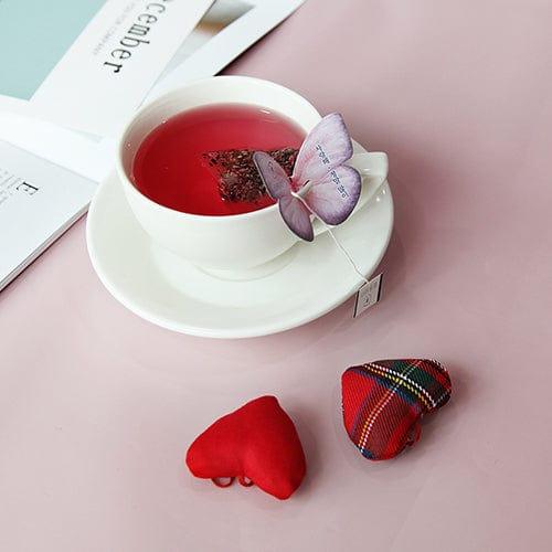 The Cockscomb Butterfly Teabag by KKOKDAM offers a charming tea experience with its butterfly-shaped holder that rests elegantly on the edge of your cup. Filled with Cockscomb flowers, the tea has a delicate flavor and a gentle floral aroma, symbolizing love and passion. Free from caffeine and additives, it provides a soothing, all-natural taste. Sourced from Korea, it’s the perfect choice for those seeking a calm and refined tea moment.