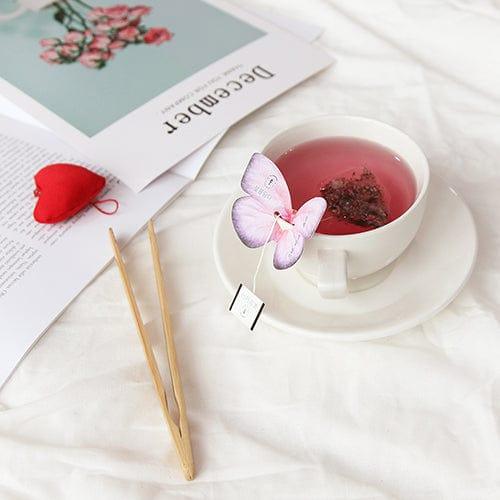 The Cockscomb Butterfly Teabag by KKOKDAM features a beautifully crafted butterfly-shaped holder, adding a whimsical touch to your tea experience. Inside, the Cockscomb tea offers a subtle, floral taste with a soft aroma, representing love and passion. This caffeine-free, additive-free tea is made with natural ingredients, ensuring a pure and calming flavor. Sourced from Korea, it’s perfect for those who enjoy a delicate, relaxing brew.