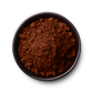 C Market Coffee's Real Chai Powder (200g) features a blend of black tea, ginger, nutmeg, cinnamon, cardamom, clove, and pepper, offering a piquant and spicy flavor with distinct Goan Malabar Coast spice notes. It has a medium caffeine level and can be prepared by mixing 1/2 teaspoon of powder with hot water, followed by steamed milk and sweetener of choice, such as maple syrup or honey.