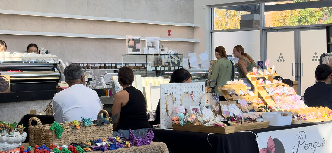 A lively and crowded interior at C Market Coffee during one of our Pop-Up Markets, with customers browsing local artisan goods and enjoying the vibrant, community-focused atmosphere filled with excitement and energy.